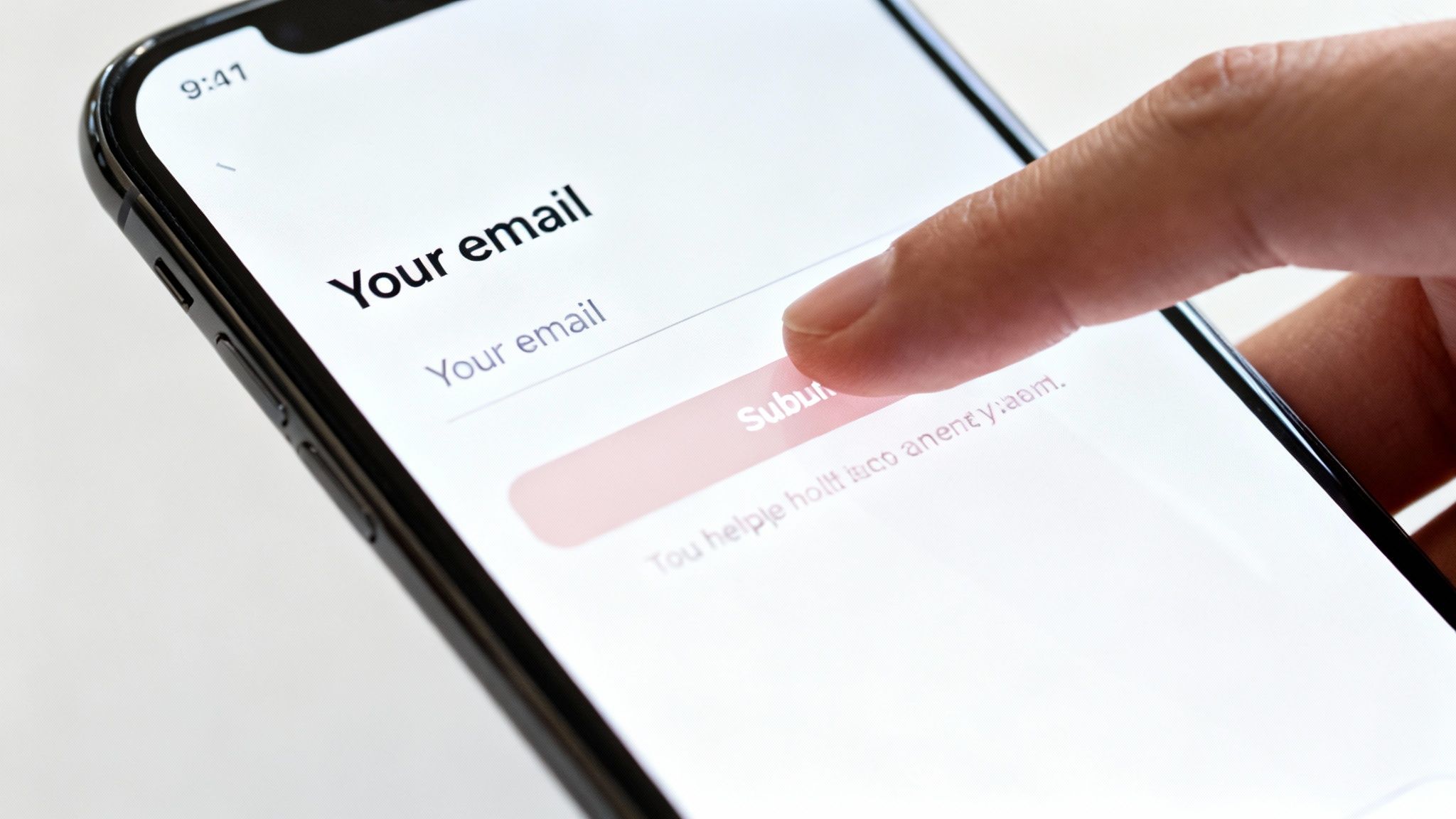 A close-up of a finger tapping a 'Submit' button on a smartphone screen displaying an email input form.