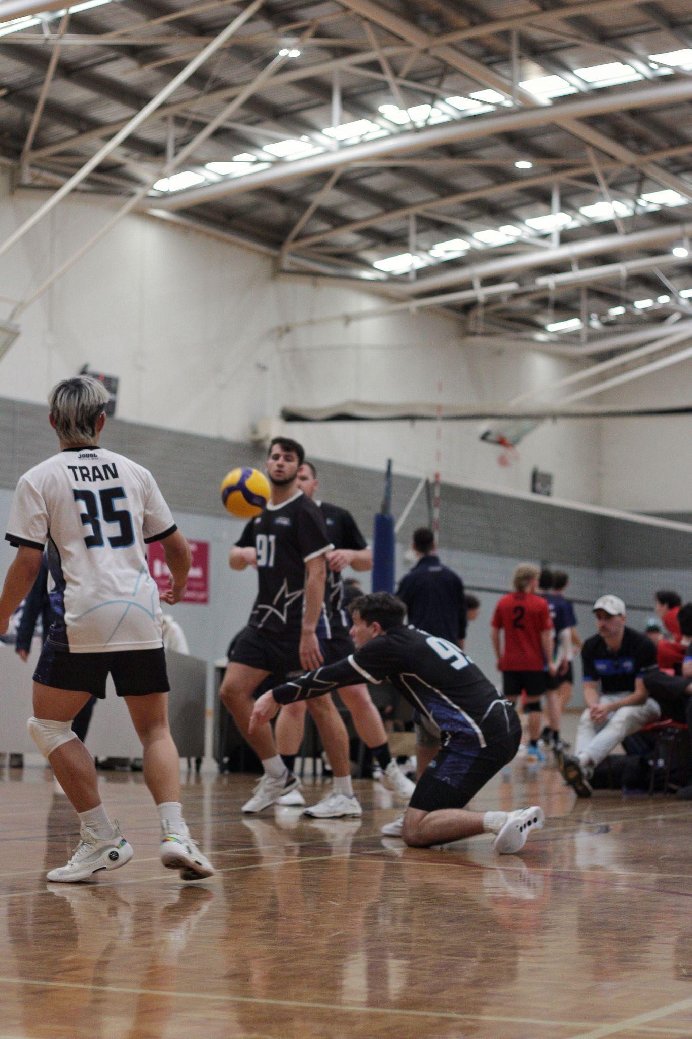Ethan playing in an indoor volleyball match