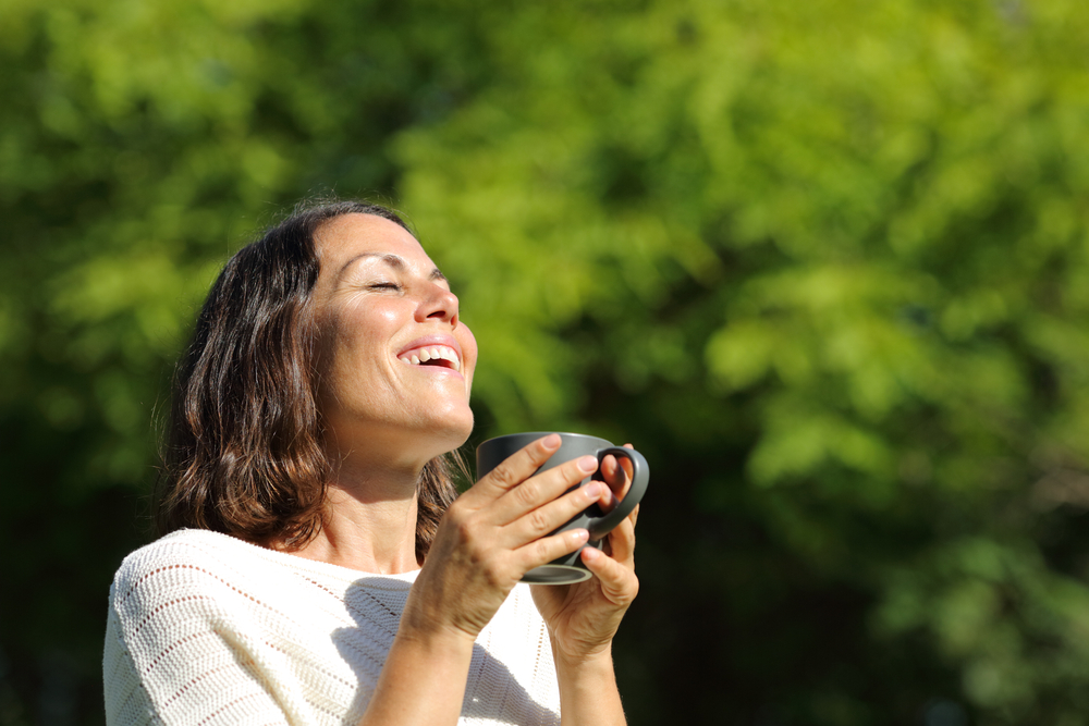 Smiling woman after TMJ treatment
