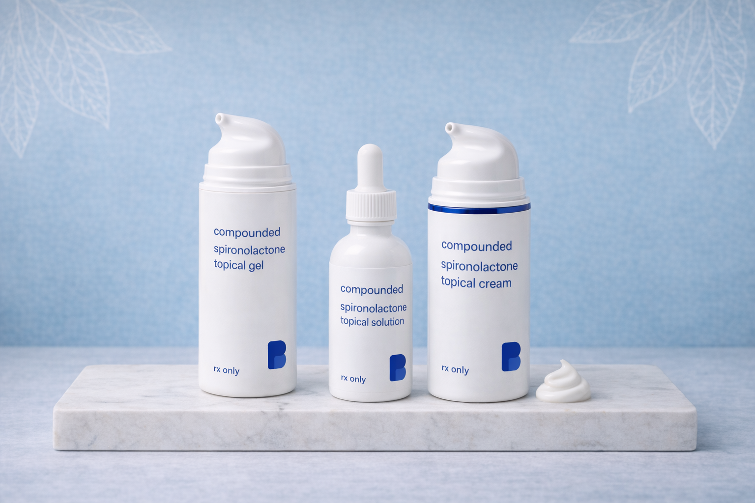 Compounded spironolactone topical gel, topical solution, and topical cream from Bayview Pharmacy on a marble plank
