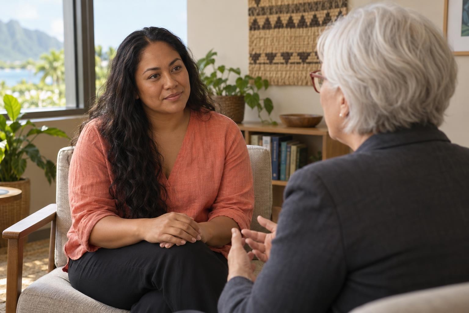 Leilani, a woman in her mid 30s, talking with her doctor in a calm clinic office