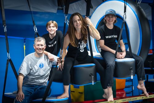 A family picture of the owners of Auburn Gymnastics Center.