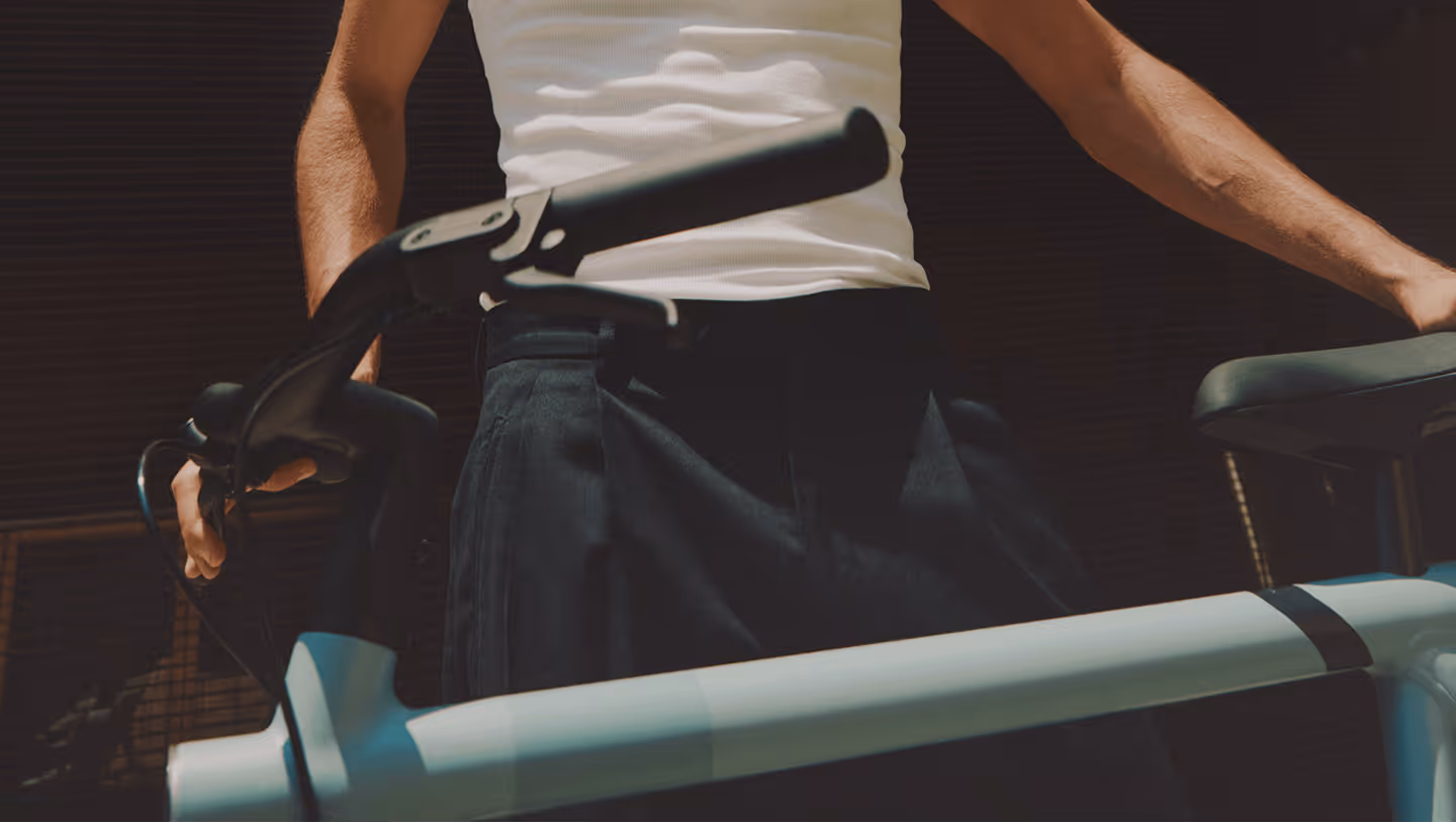 a man holding rybit bike