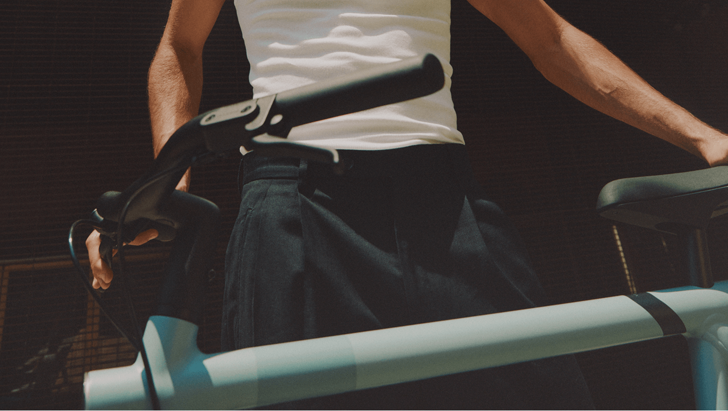 a man holding rybit bike