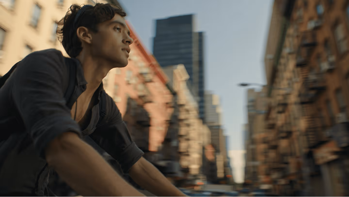 a man riding a rybit bike in the city