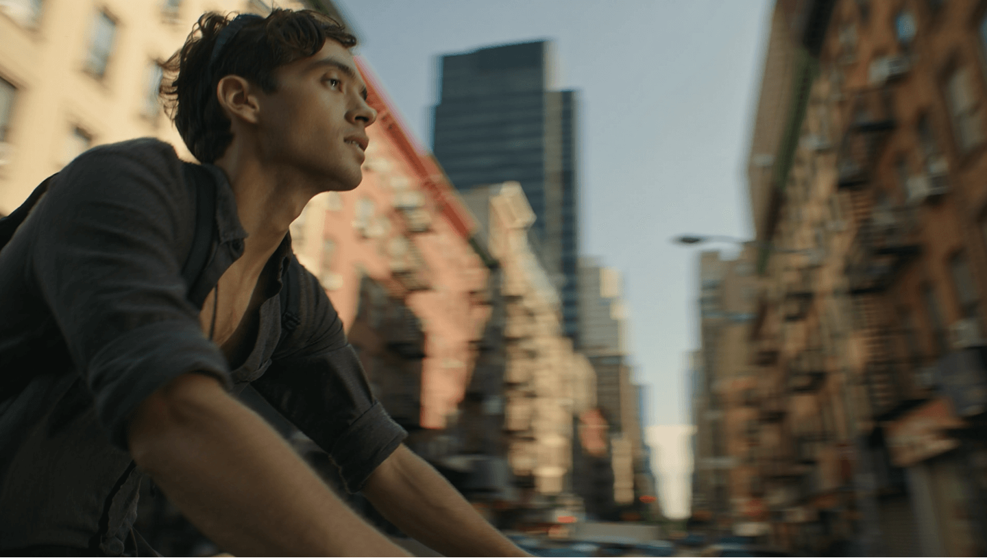 a man riding a rybit bike in the city