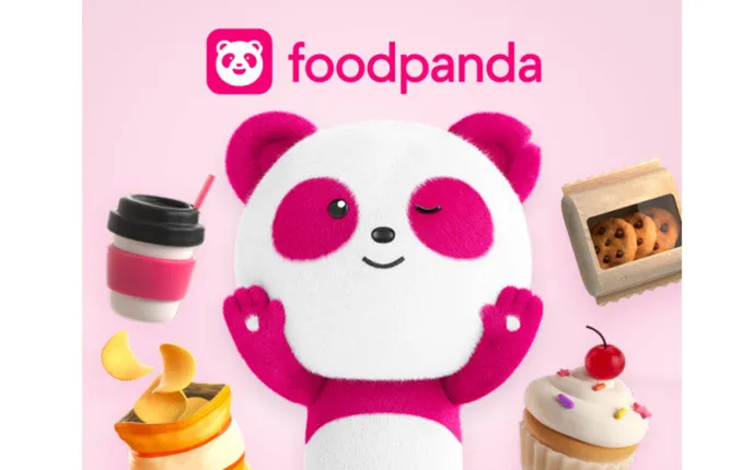 Foodpanda logo with animated pink and white panda winking, surrounded by a coffee cup, cookies, chips, and a cupcake with cherry on pink background.