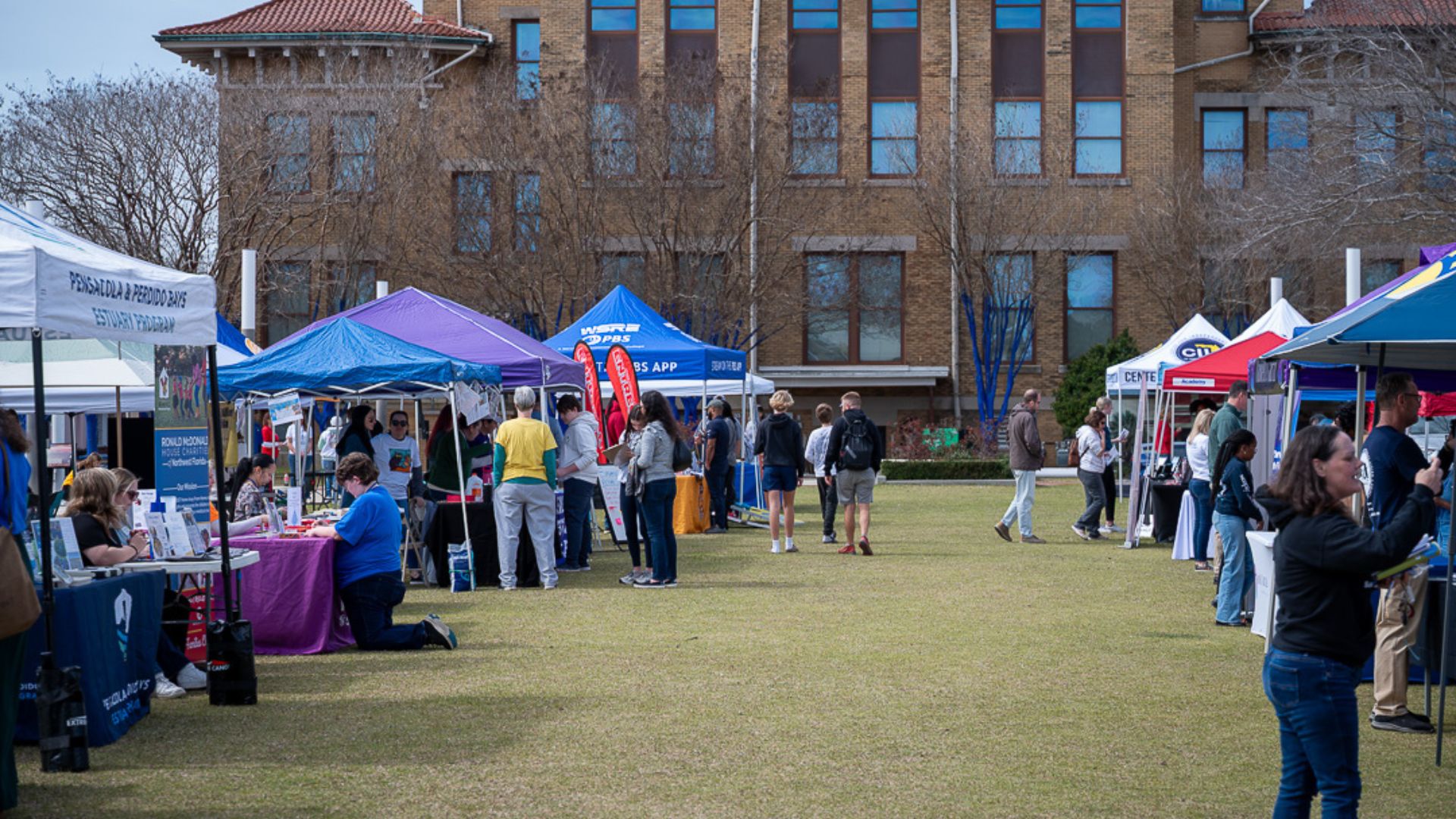 A photo of several booths outside at the PYP Nonprfoit Expo 2025.