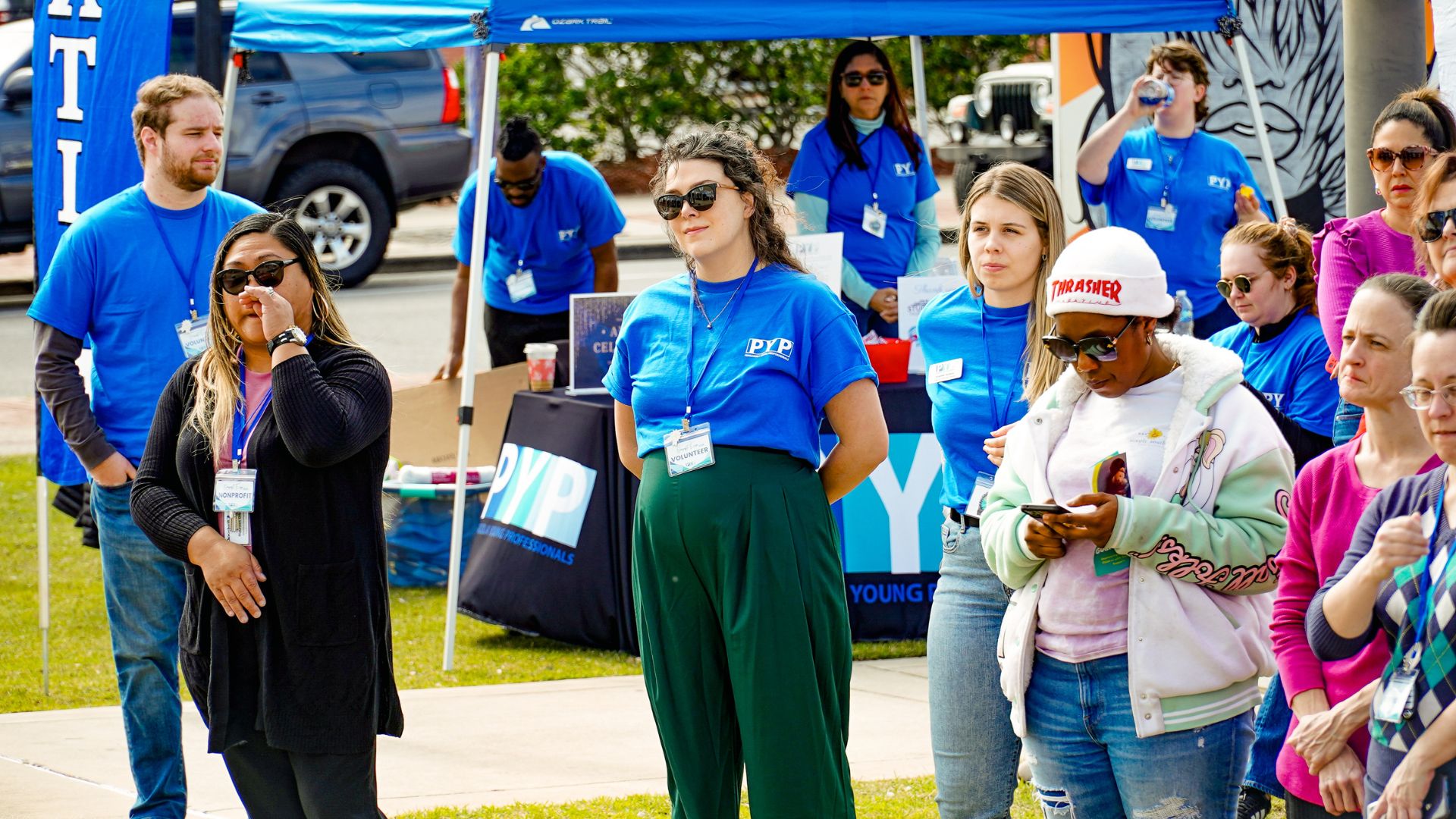 A group of people outside at the PYP Nonprfoit Expo 2025.