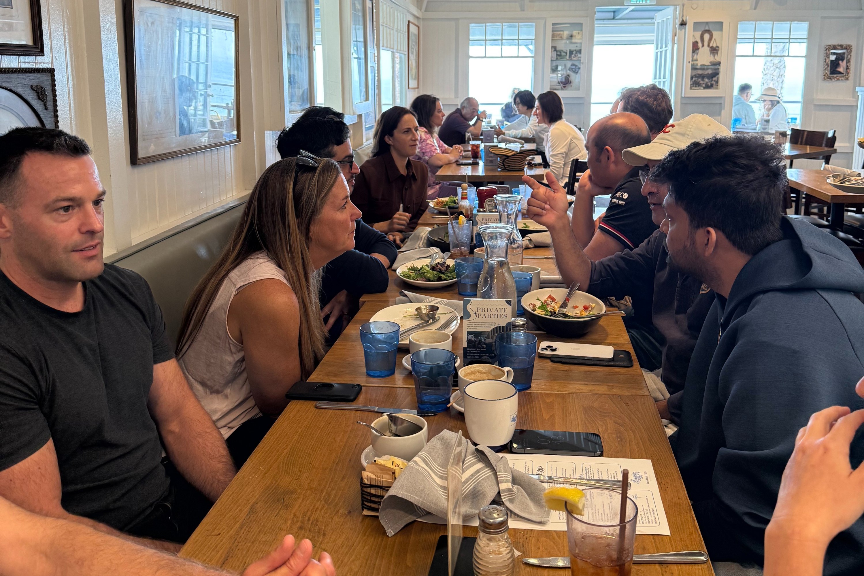 Startup investors discuss deals at a community meetup.