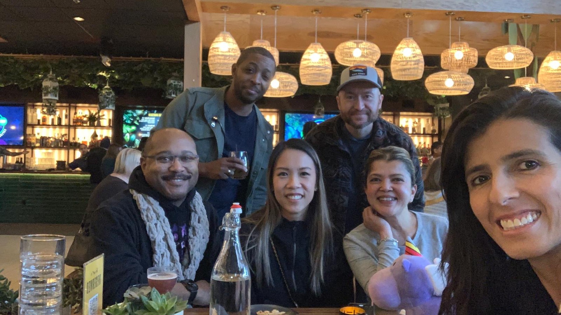 Angel Squad investors gathering around a restaurant table.