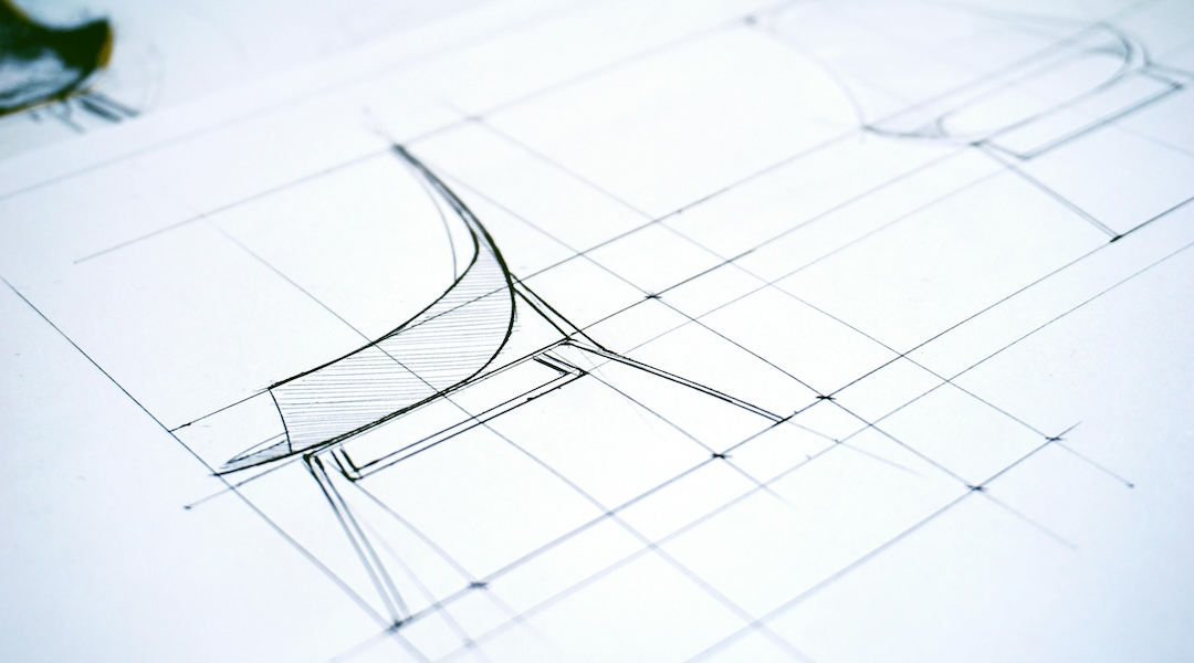 An Eames sideshell chair on drawn plans for office layout.