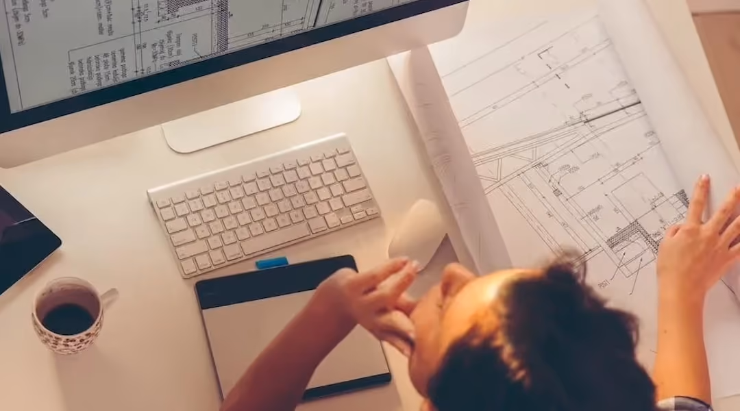 An Office Gallery International designer reviewing color swatches during an office design consultation