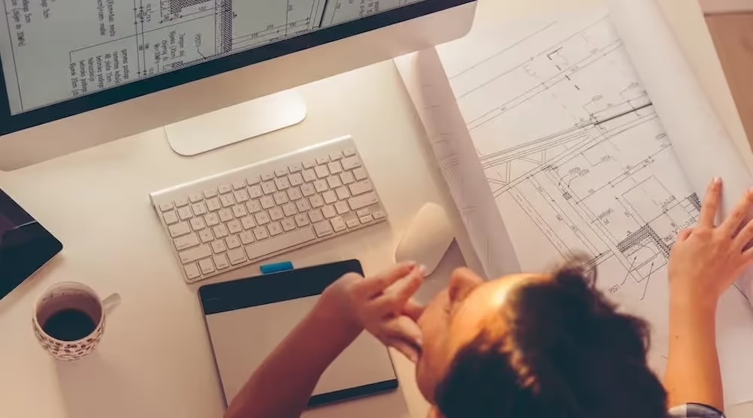 An Office Gallery International designer reviewing color swatches during an office design consultation