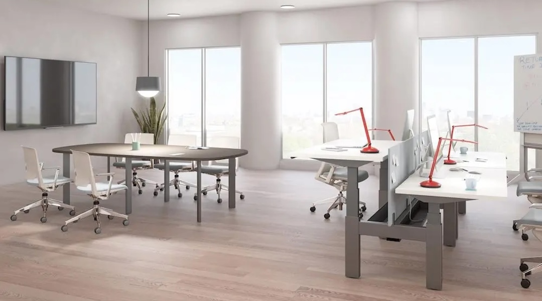 Warm task lighting over modern office workstations, showcasing Office Gallery International's lighting solutions for collaborative workspaces