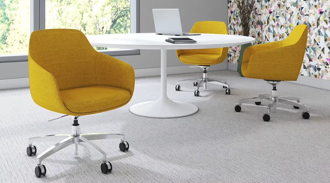 Ergonomic office chairs around a meeting table, all purchased with Office Gallery International.