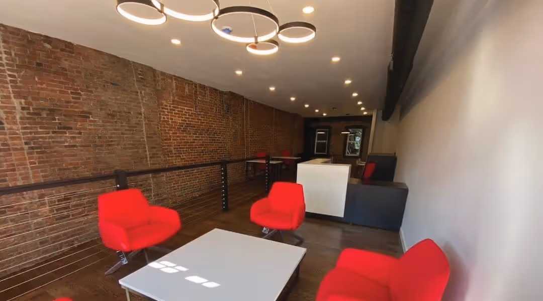 Branded luxury reception area designed by Office Gallery International for The Agency real estate in Boston