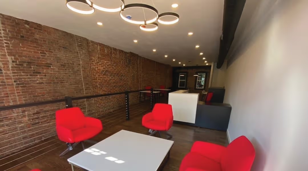 Branded luxury reception area designed by Office Gallery International for The Agency real estate in Boston