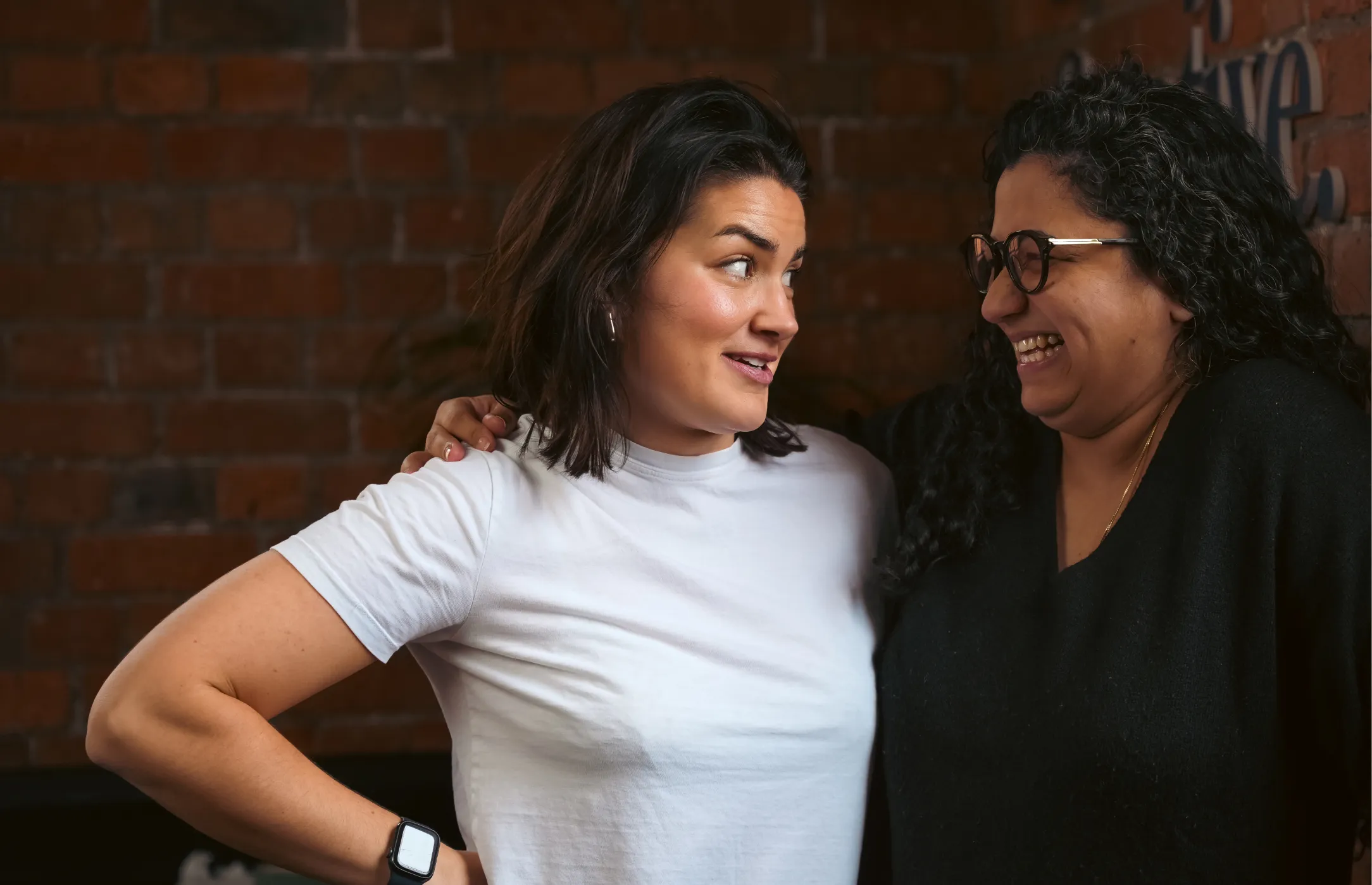Hannah and a colleague share a moment.