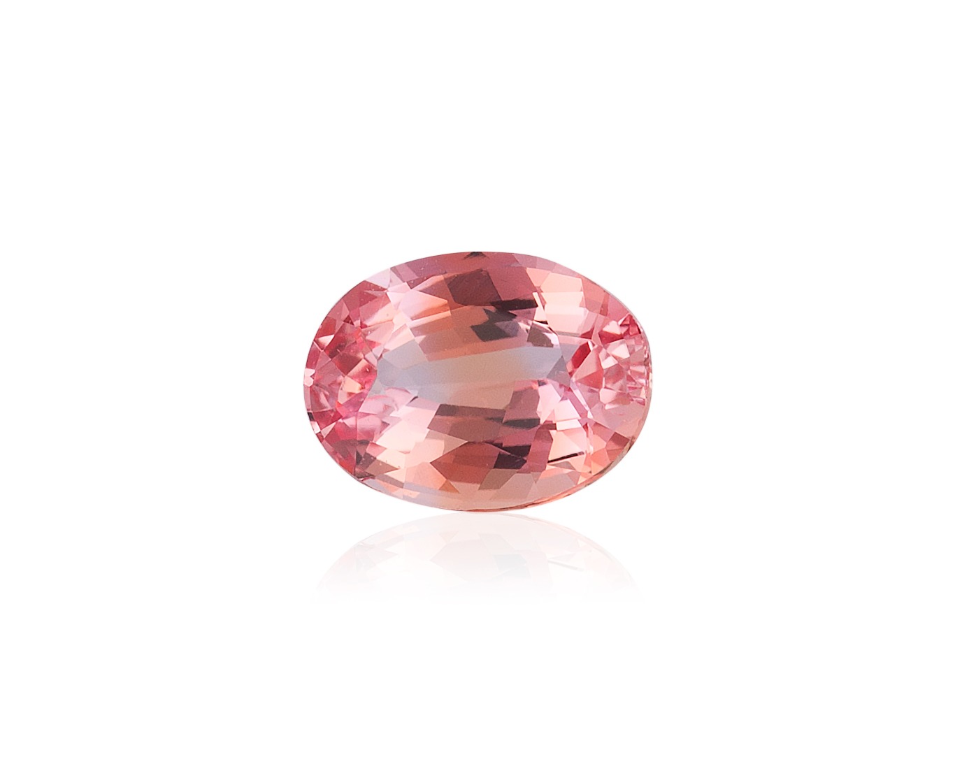 Four faceted oval gemstones arranged in two rows, with teal-colored stones on top and purple-pink stones below.