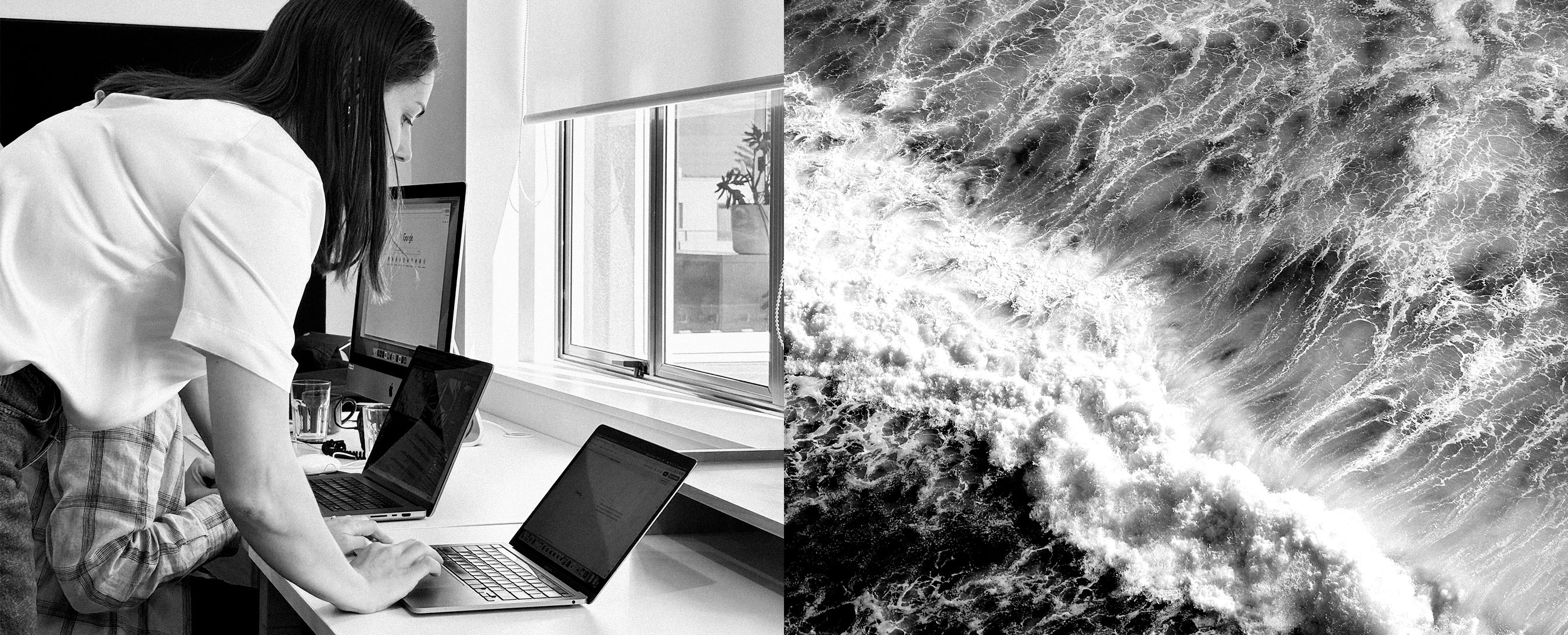 Person looking at a computer on a table, waves crashing on right.
