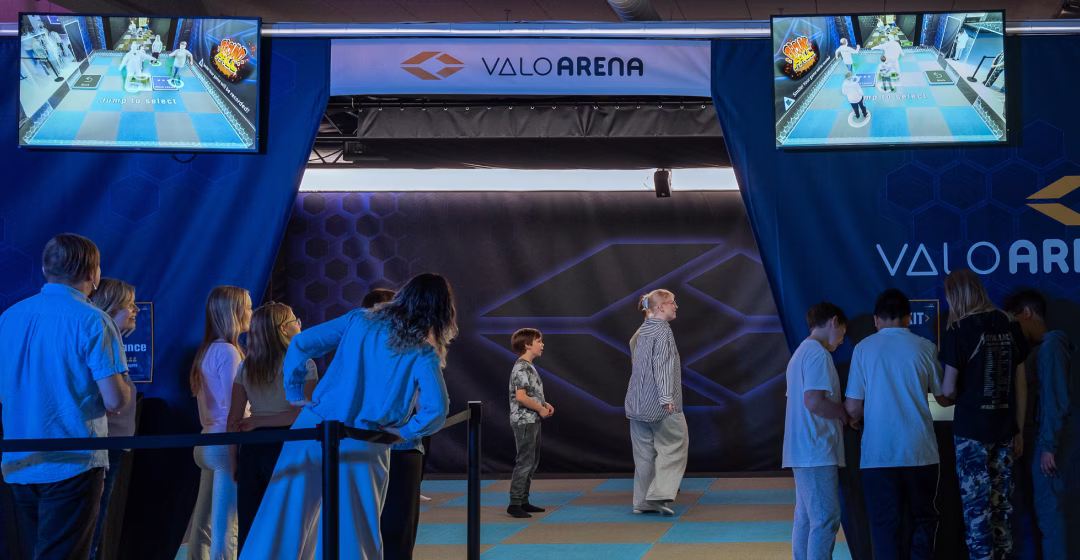 A crowd of people queueing outside of ValoArena.