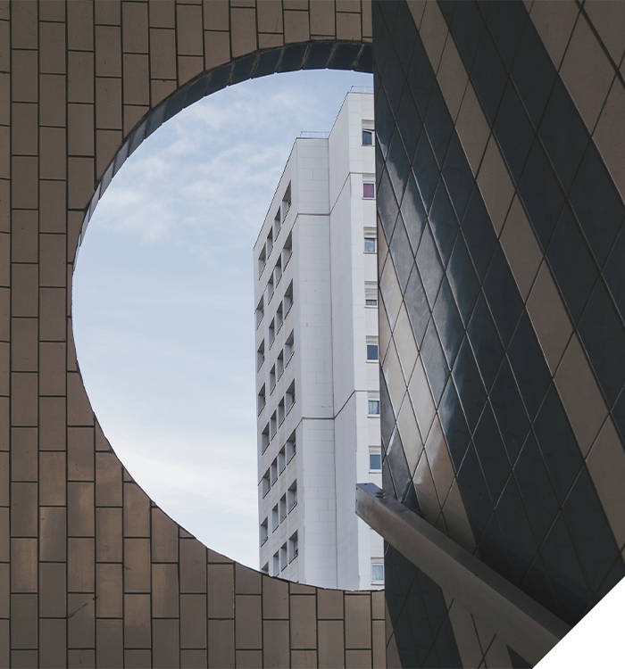 Old architecture and new architecture divided diagonally by a line.