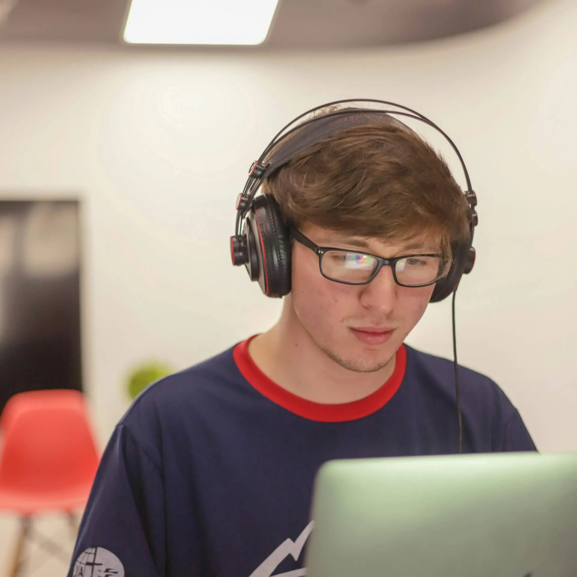 Young person sitting at laptop