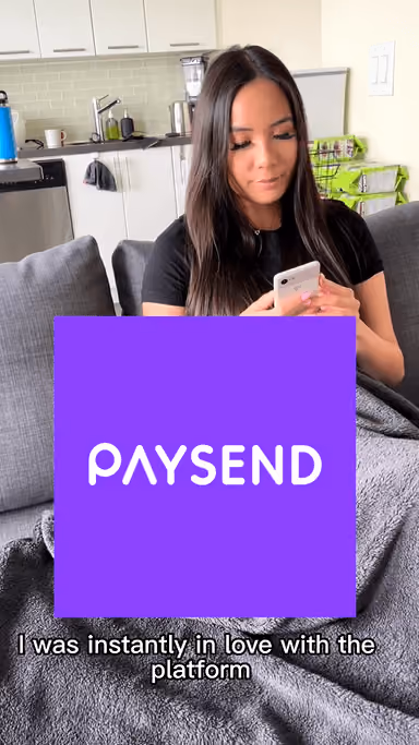 paysend logo and a woman with a phone
