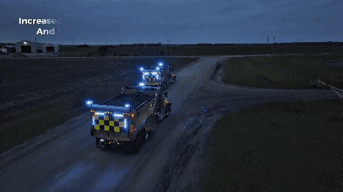 Snowplows in echelon at dusk with synchronized Whelen V2V warning lights for operator awareness and motorist visibility