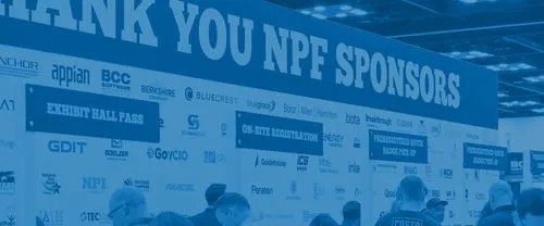 Event area showing a large banner with 'THANK YOU NPF SPONSORS' and various company logos beneath, with people standing in front of registration and badge pick-up signs.
