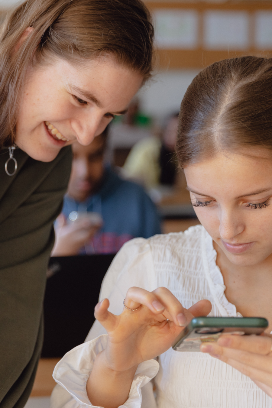 Photograph of a teacher with a student.