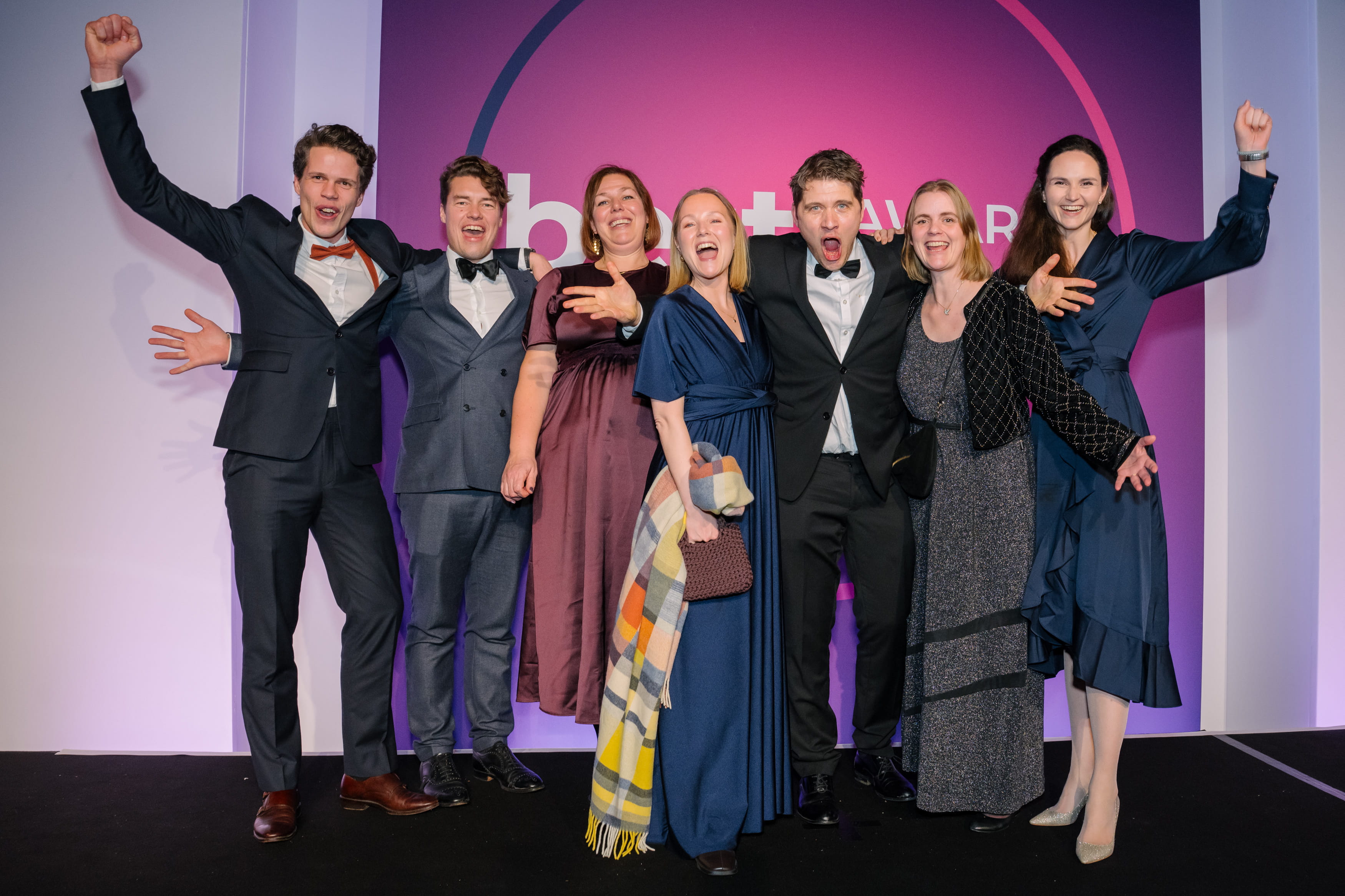 The Gyldendal and Ludenso teams standing together on the BETT awards stage, celebrating the BETT nomination