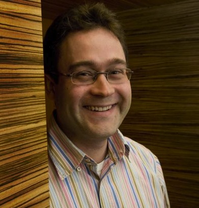 A portrait of Timo Hannay smiling