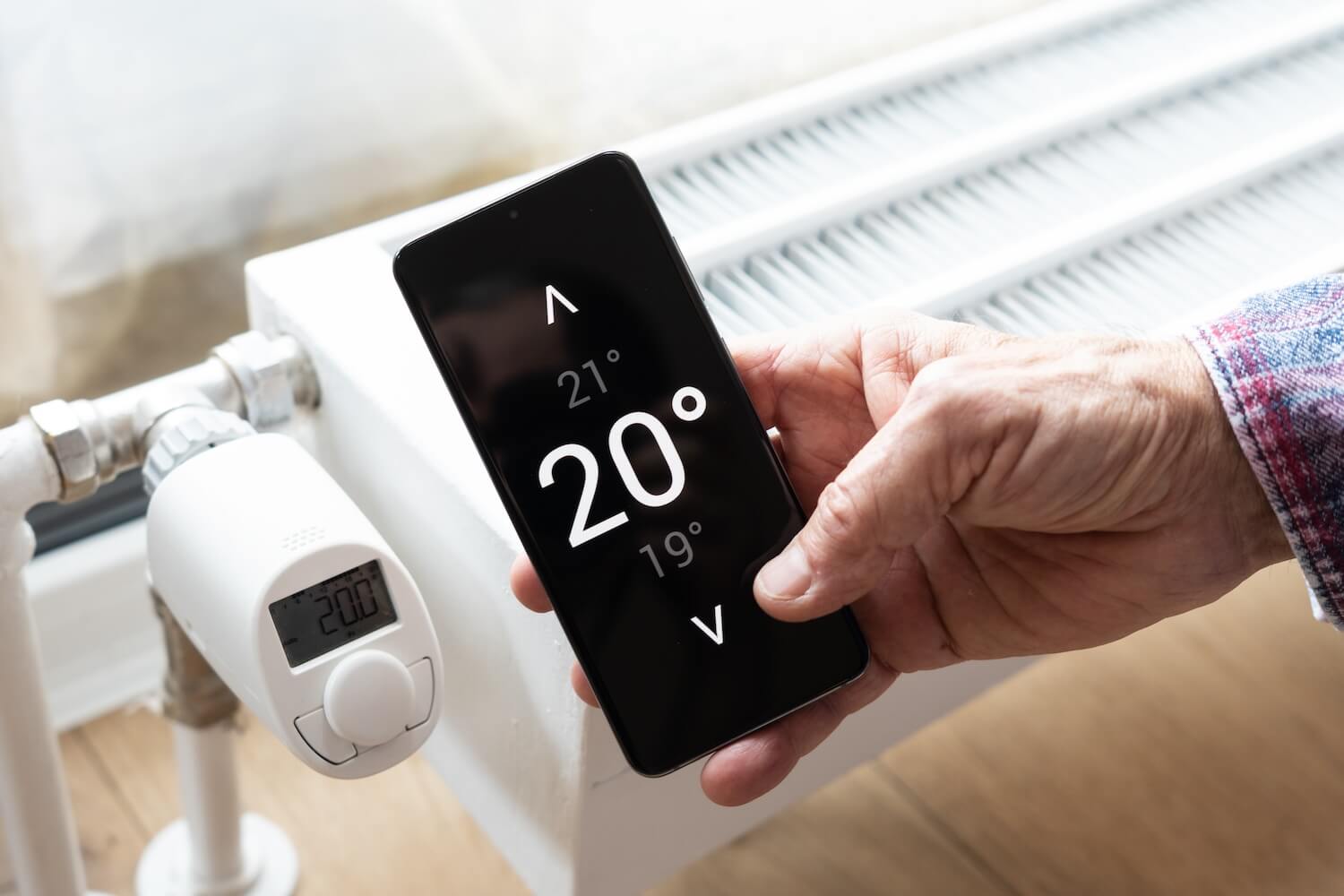 Smartphone-App zur Temperatursteuerung eines Heizsystems mit Geofencing Heizung.