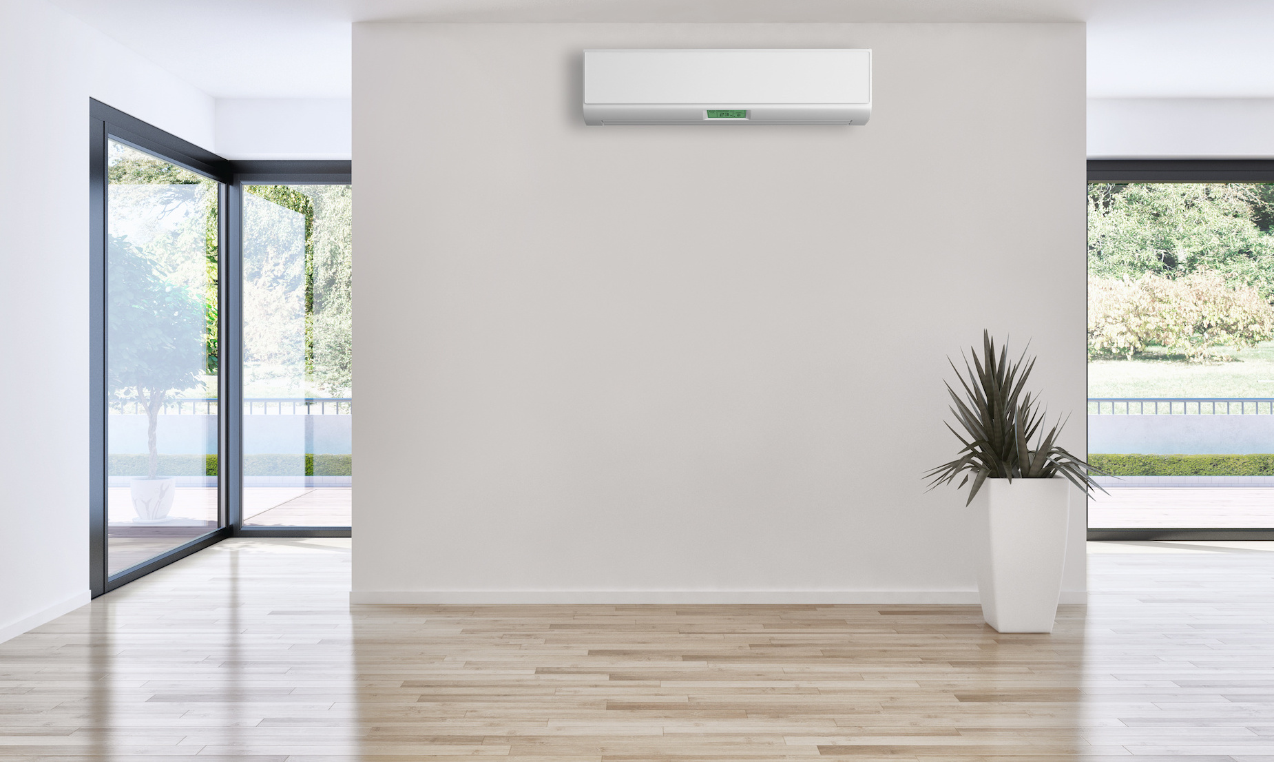 Ein Wohnbereich mit großen Fensterfronten und einer Lüftungsanlage – hier müssen Sie keine manuelle Fensterlüftung vornehmen
