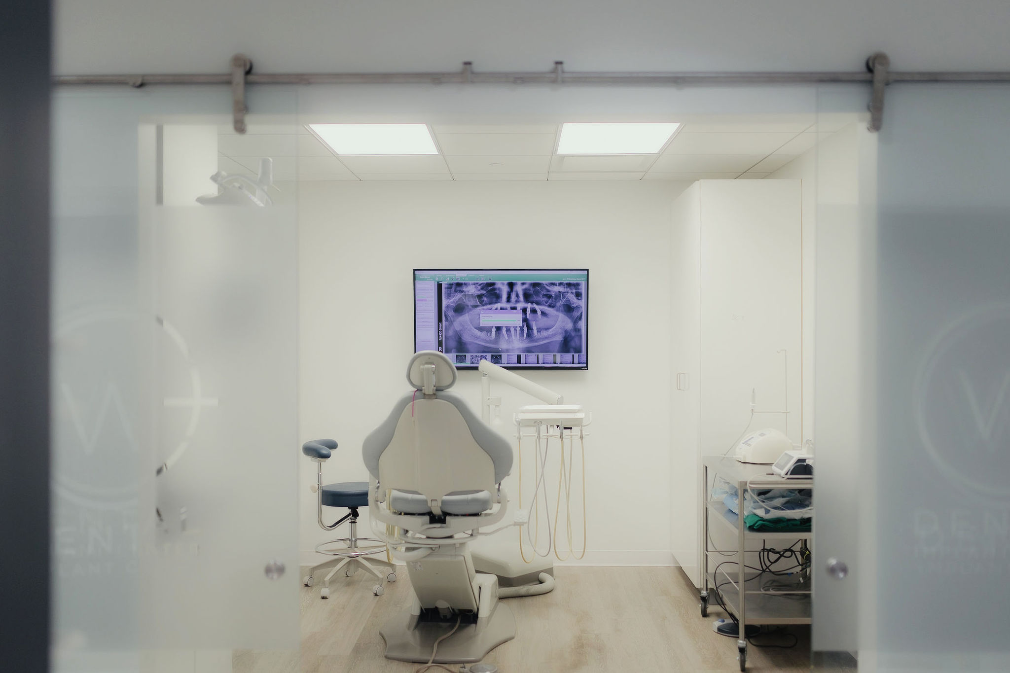 Dr. Ku laughing with a female patient at W Plus Dental