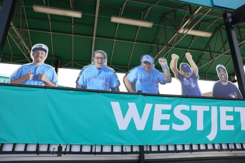 My brother, my dad, and I attending a Blue Jays game during the pandemic in Buffalo as cardboard cutouts
