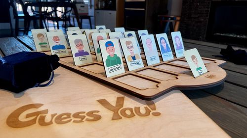 A wooden Guess Who game I made for my 3-year-old nephew, where the characters are all family members.