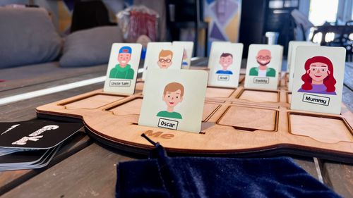 A wooden Guess Who game I made for my 3-year-old nephew, where the characters are all family members.