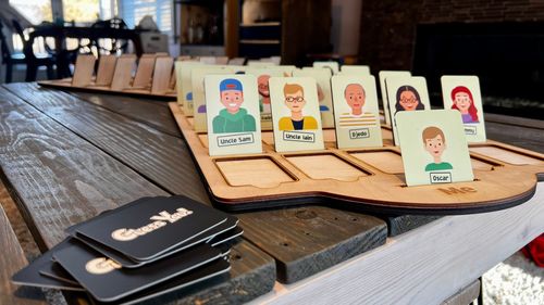 A wooden Guess Who game I made for my 3-year-old nephew, where the characters are all family members.