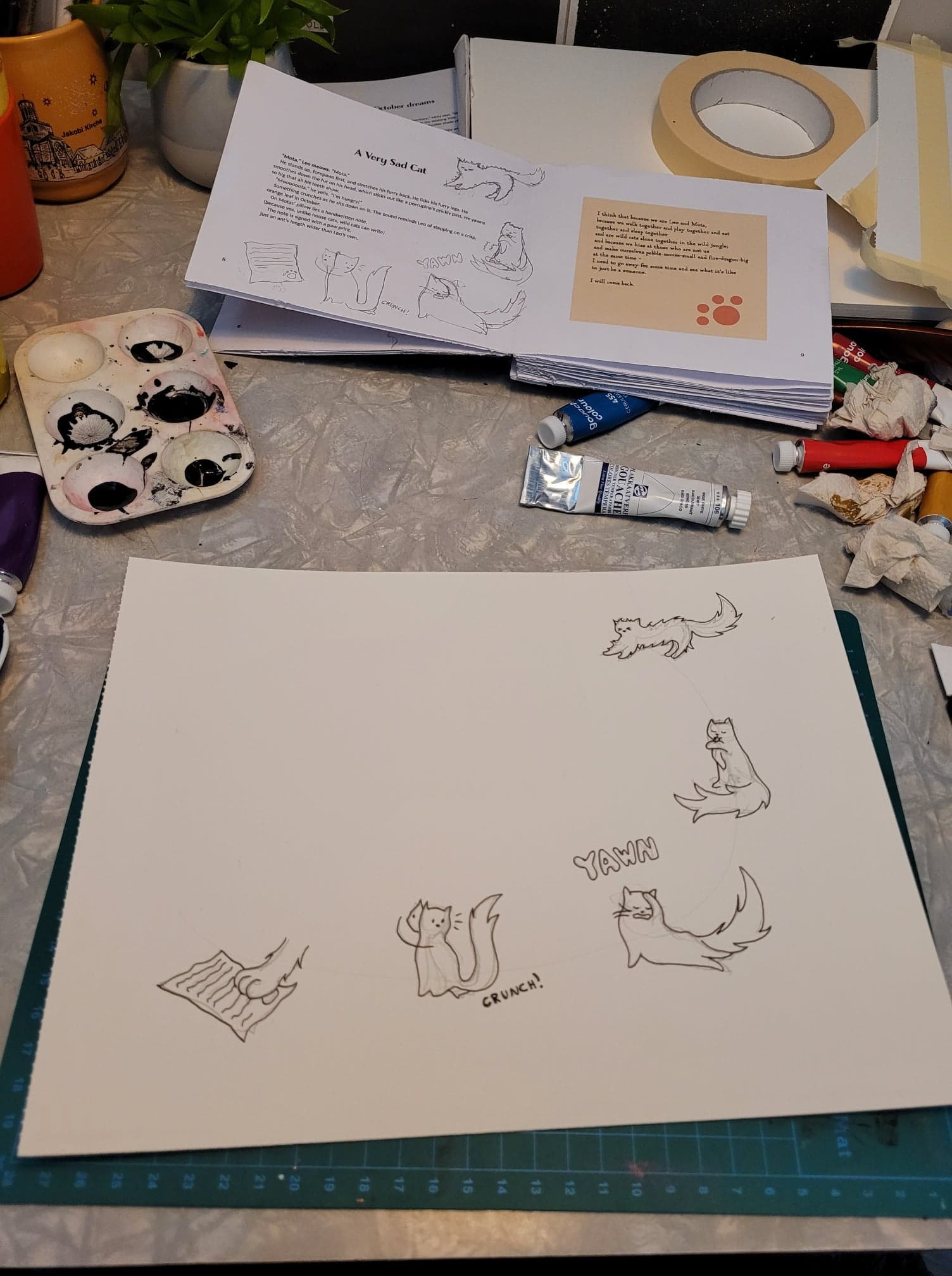 A messy workspace, with an in-prgress painting in the foreground