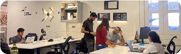People working in an office with drones.