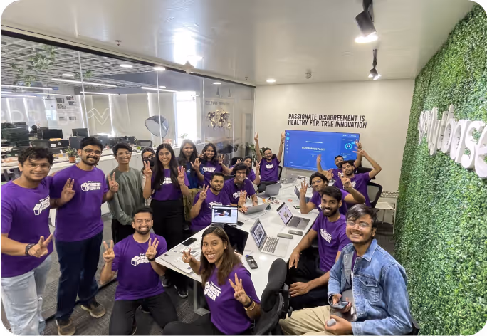 Team celebrating with peace signs.