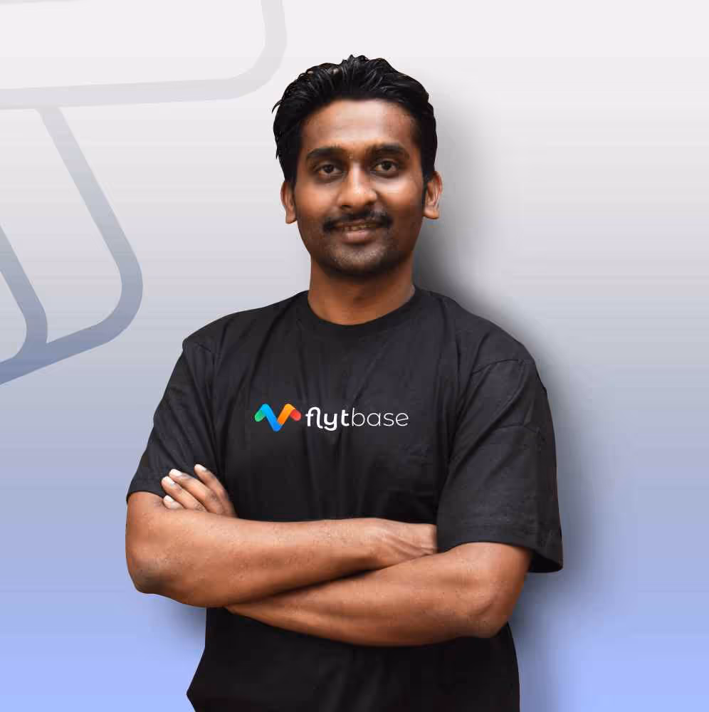 Man in black shirt with logo.