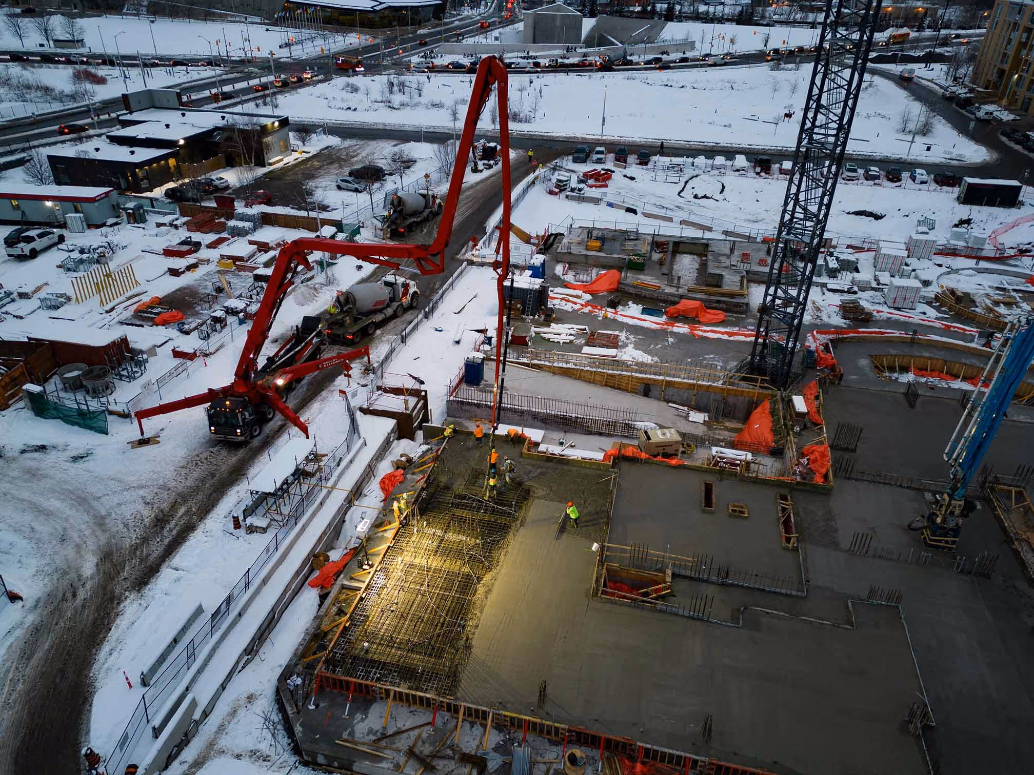 Concrete being poured at a construction site.