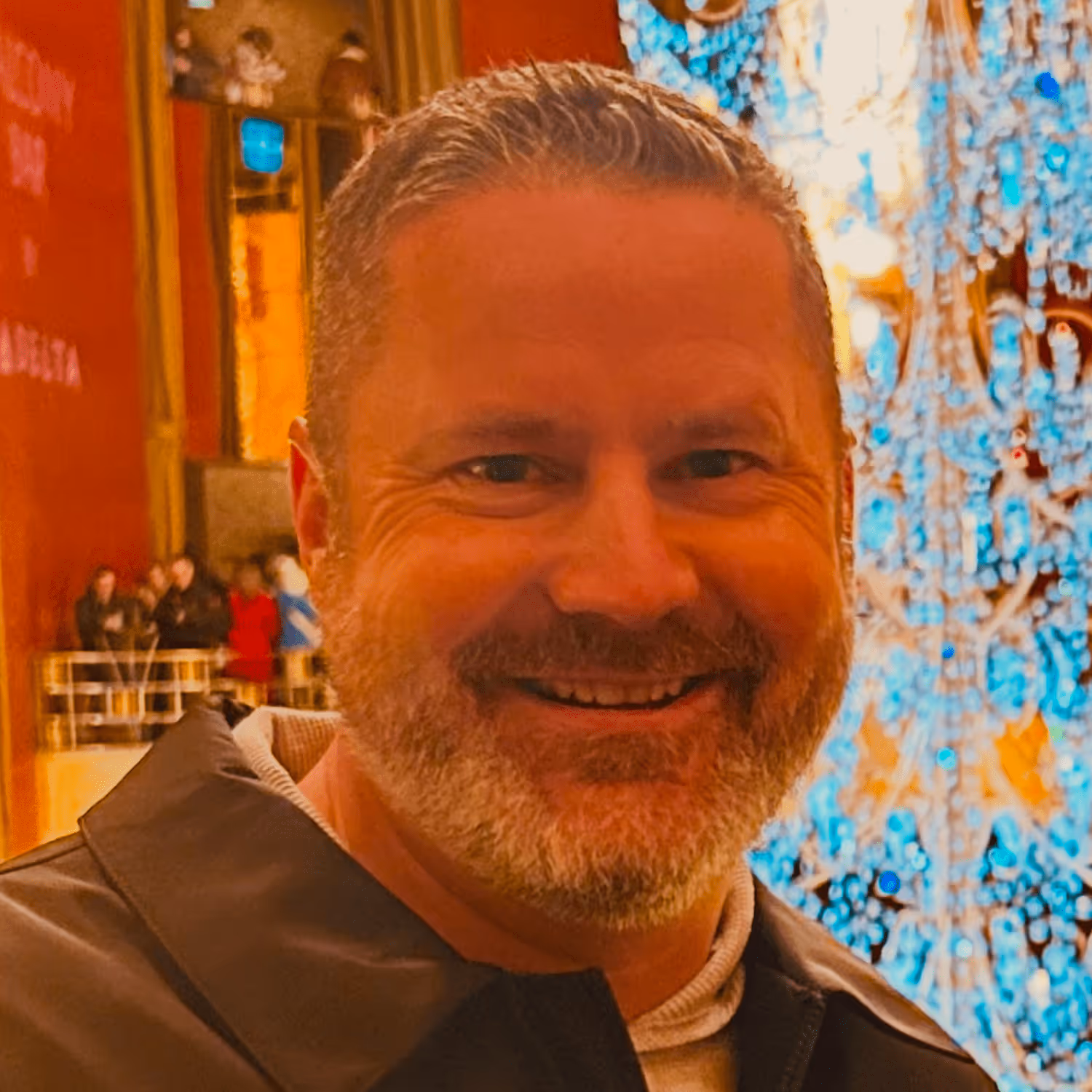 Smiling man with short gray hair.