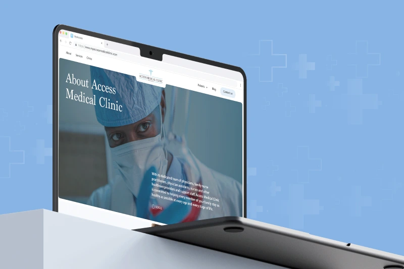Healthcare website for Access Medical Clinic open on a laptop, featuring a masked medical professional and clean blue design.