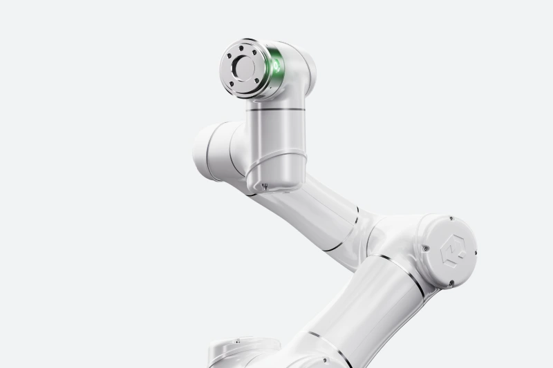 Sleek white robotic arm with articulated joints, engineered for industrial automation and precision manufacturing.