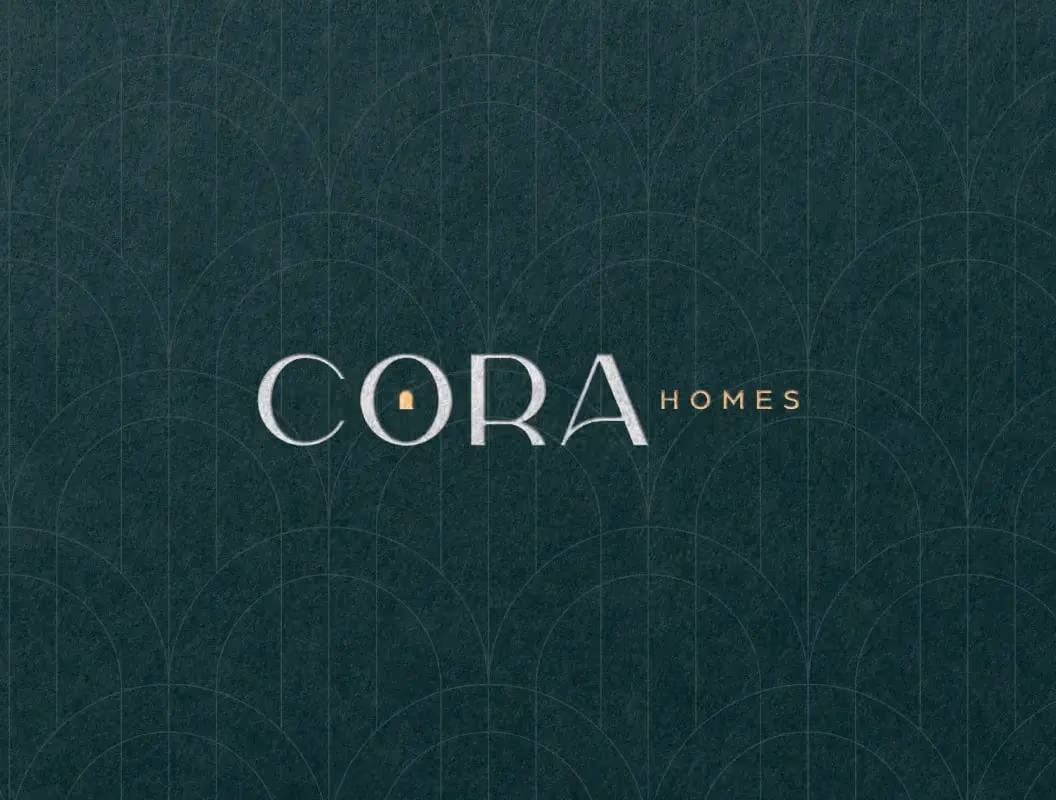 Modern Cora Homes logo design with elegant typography and dark textured background.